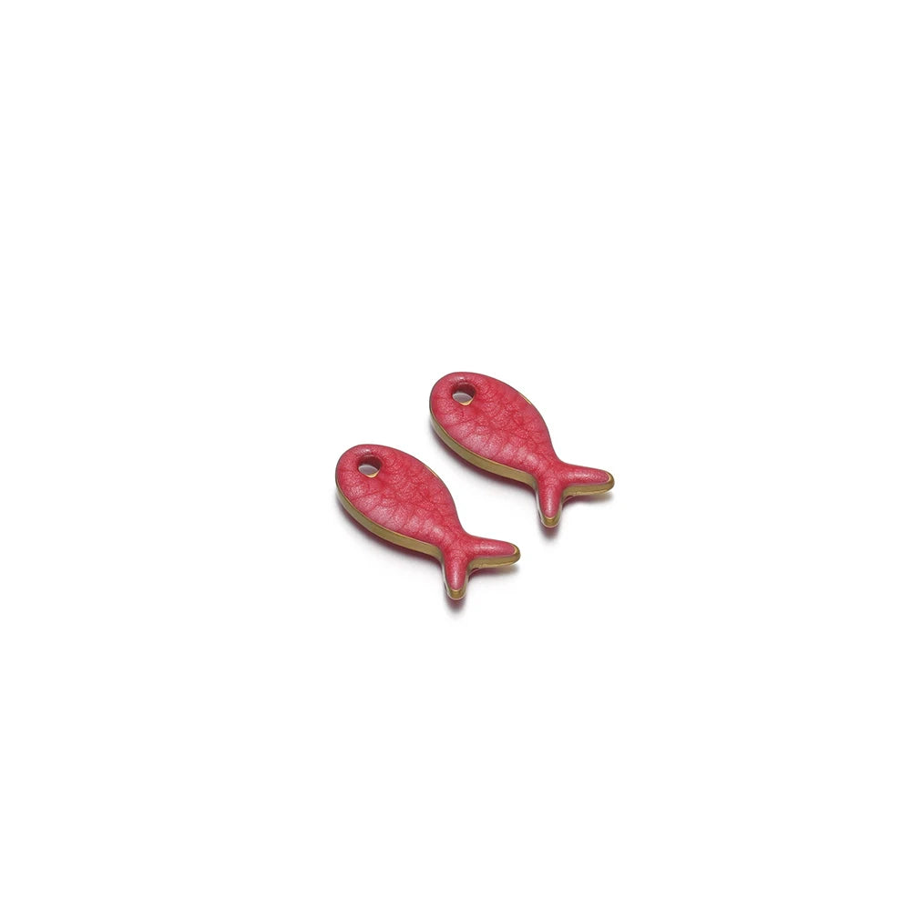 Pair of red double-sided fish charms with round hanging holes