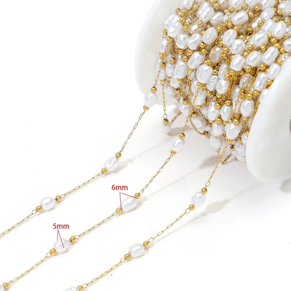 Artificial pearl chain with gold links and 5mm white oval beads