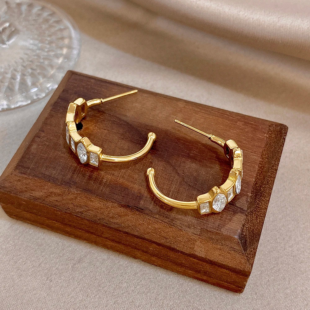 Gold-tone hoop earrings with stacked zirconia square links
