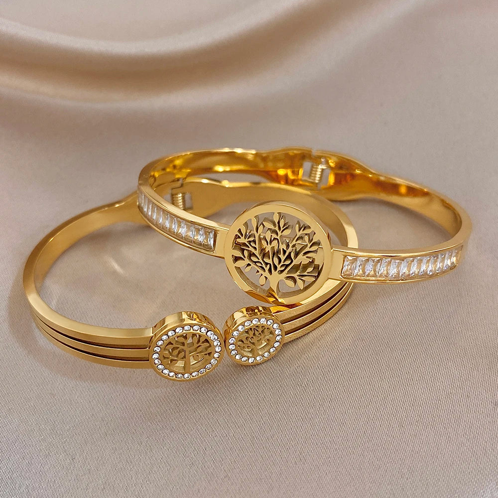 Gold-tone stackable bracelets with tree-of-life medallion and row of clear stone trim