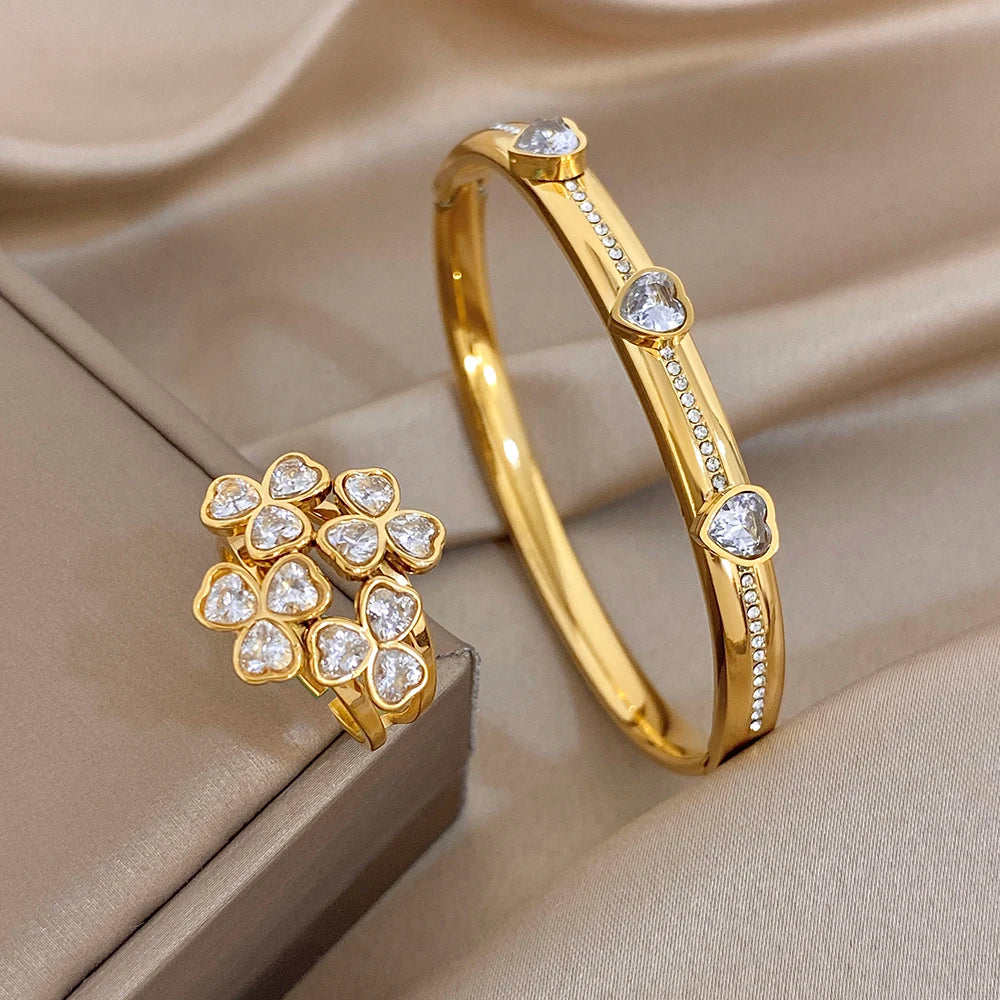 Gold-tone heart-stone bangle bracelet with flower cluster ring and clear gems