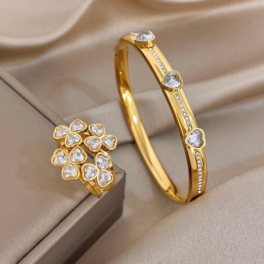 Gold-tone heart-stone bangle bracelet with flower cluster ring and clear gems