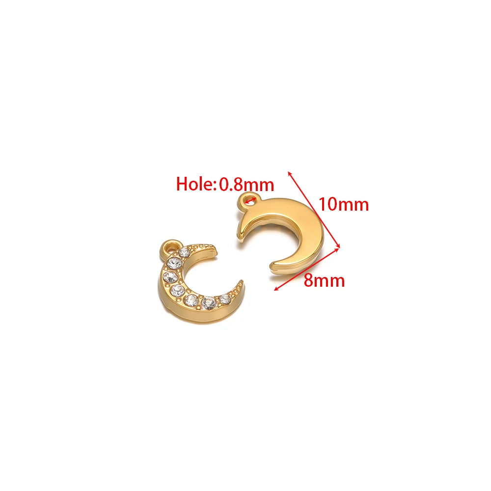 Two gold-tone crescent moon charm pendants, one with rhinestones and hanging loops