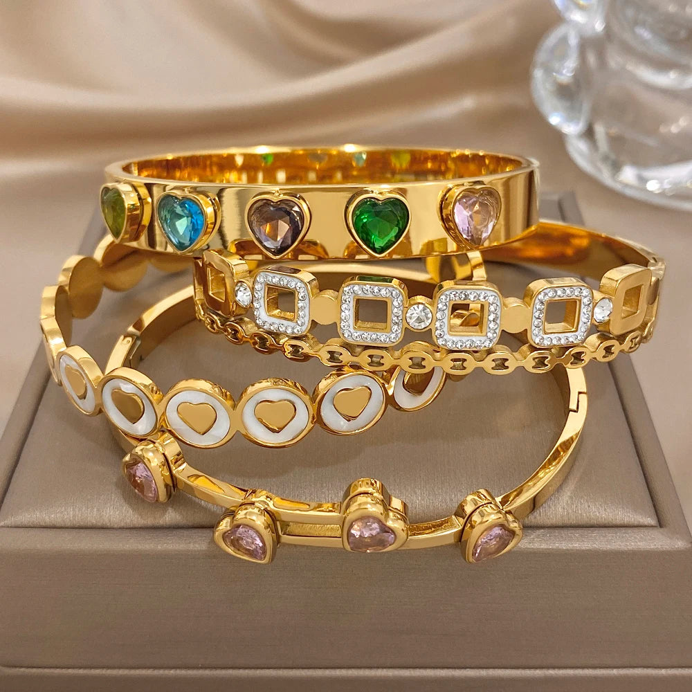 Gold-plated wide cuff bangle with heart and square zircon stone settings