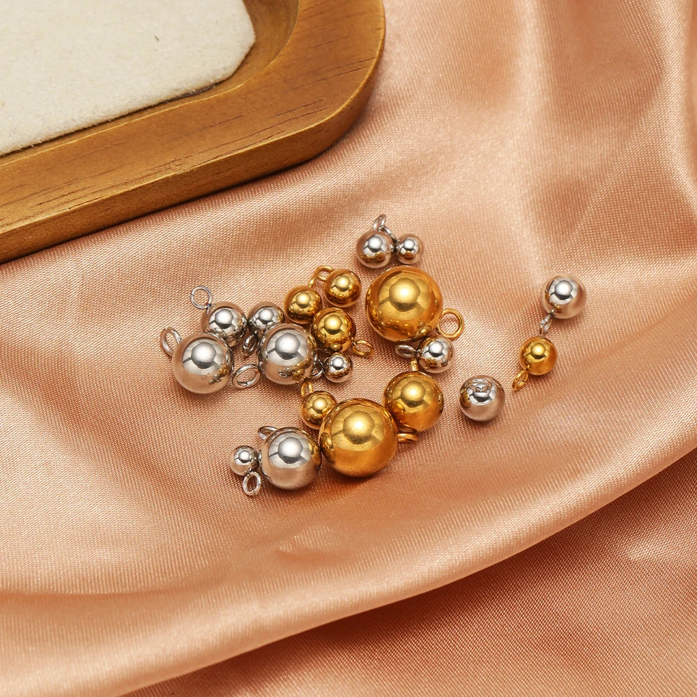 Assorted gold and silver plated ball charms with loop rings, solid spherical pendant beads