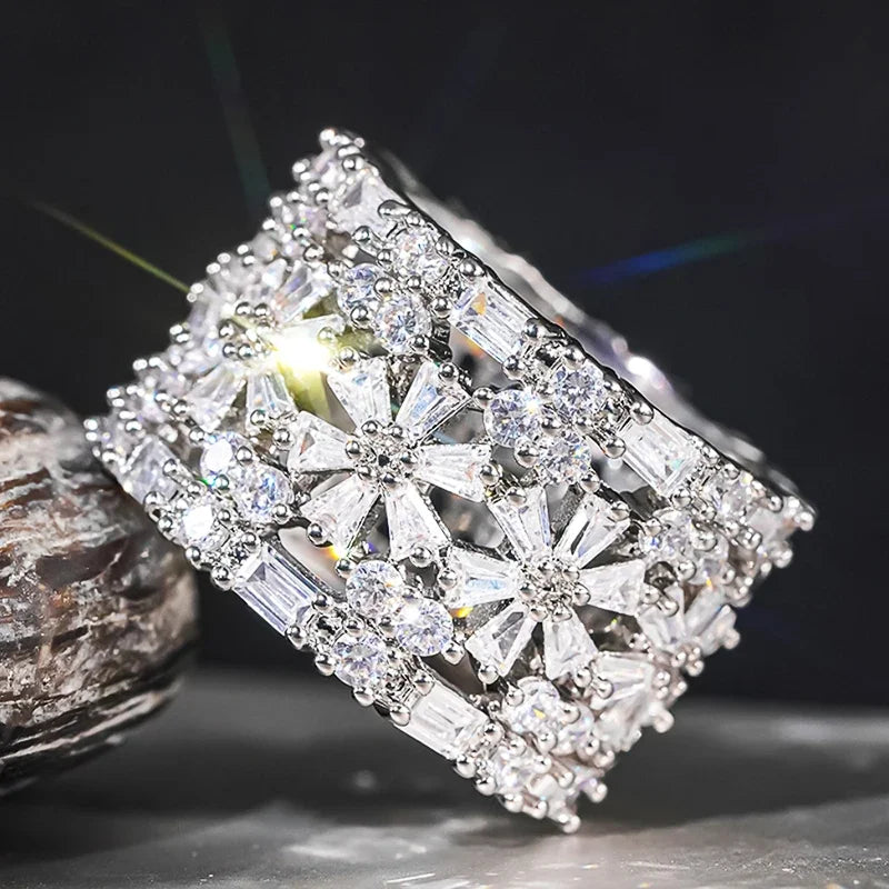 Square CZ halo ring with clear baguette and round stones on silver-toned band