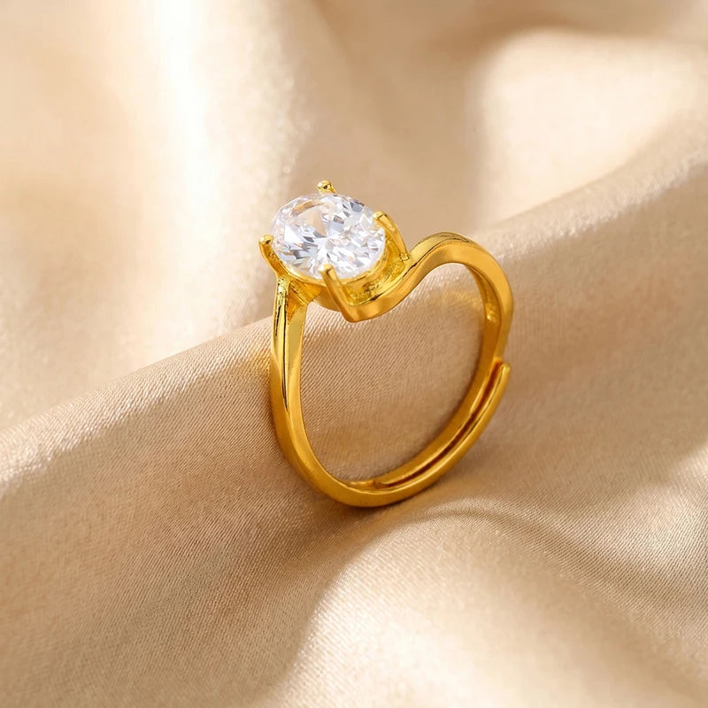 Gold-tone solitaire ring with oval-cut cubic zirconia center