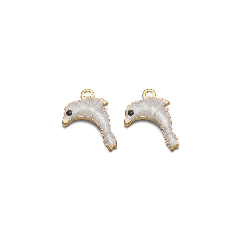 Pair of light silver enamel dolphin charms with gold-tone loop and black eye details