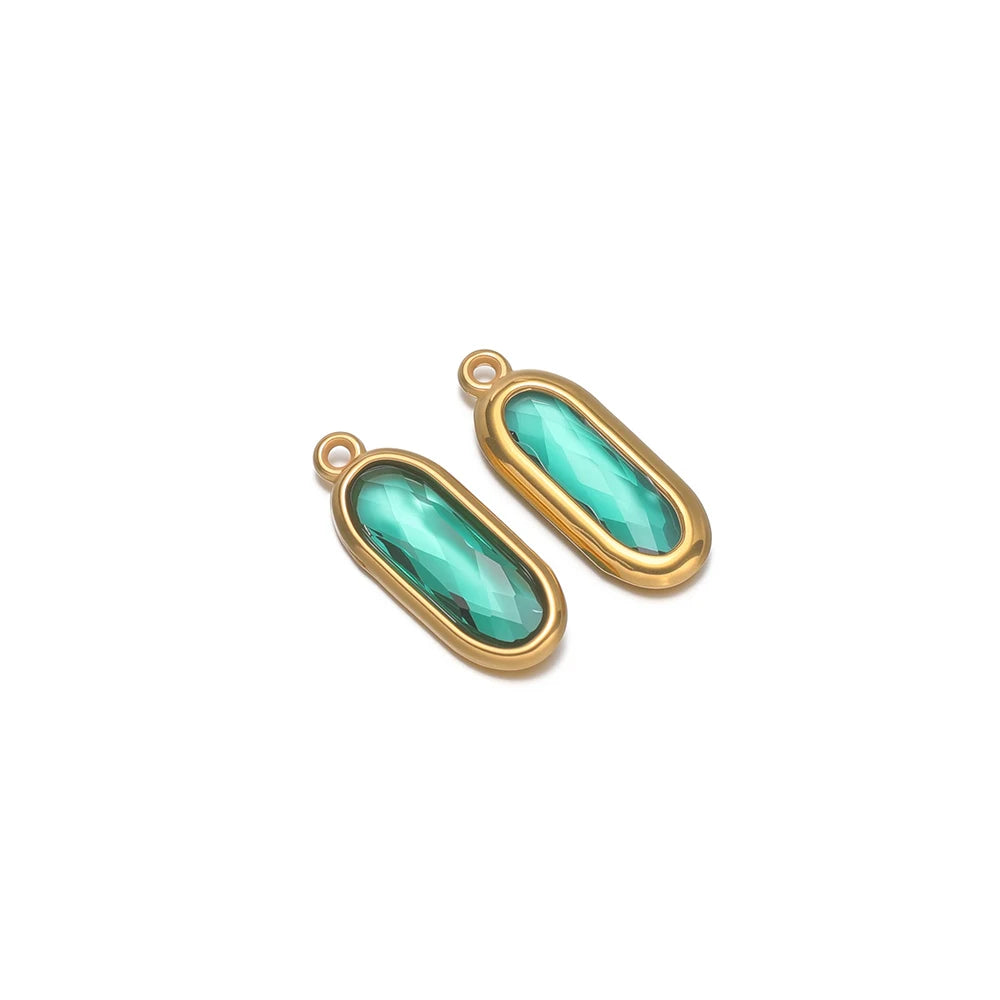 Oval glass charm connectors, teal green glass in gold bezels, with hanging loops