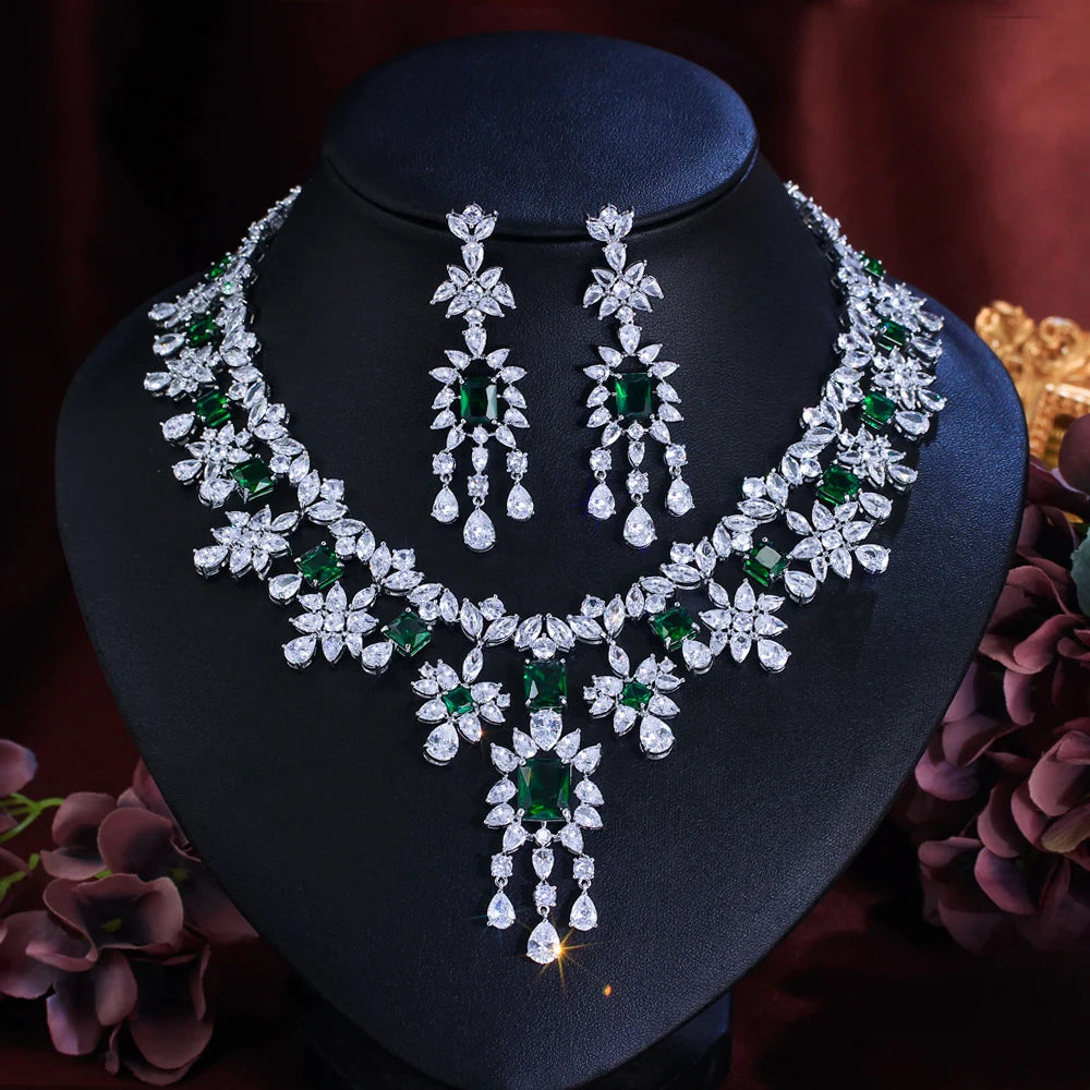 Floral necklace with emerald green stones and matching long drop earrings