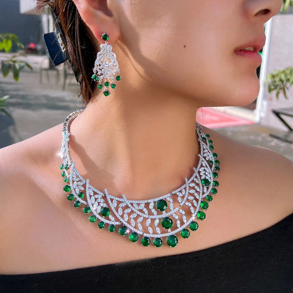 Choker-style necklace with green stones and matching drop earrings in silver-tone