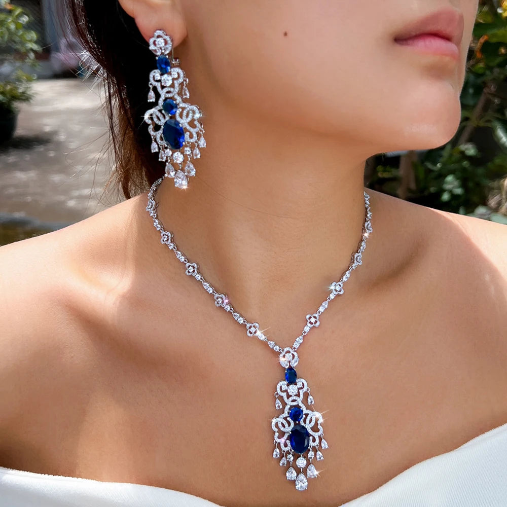 Royal blue crystal jewelry set: silver-tone necklace with pendant and chandelier earrings