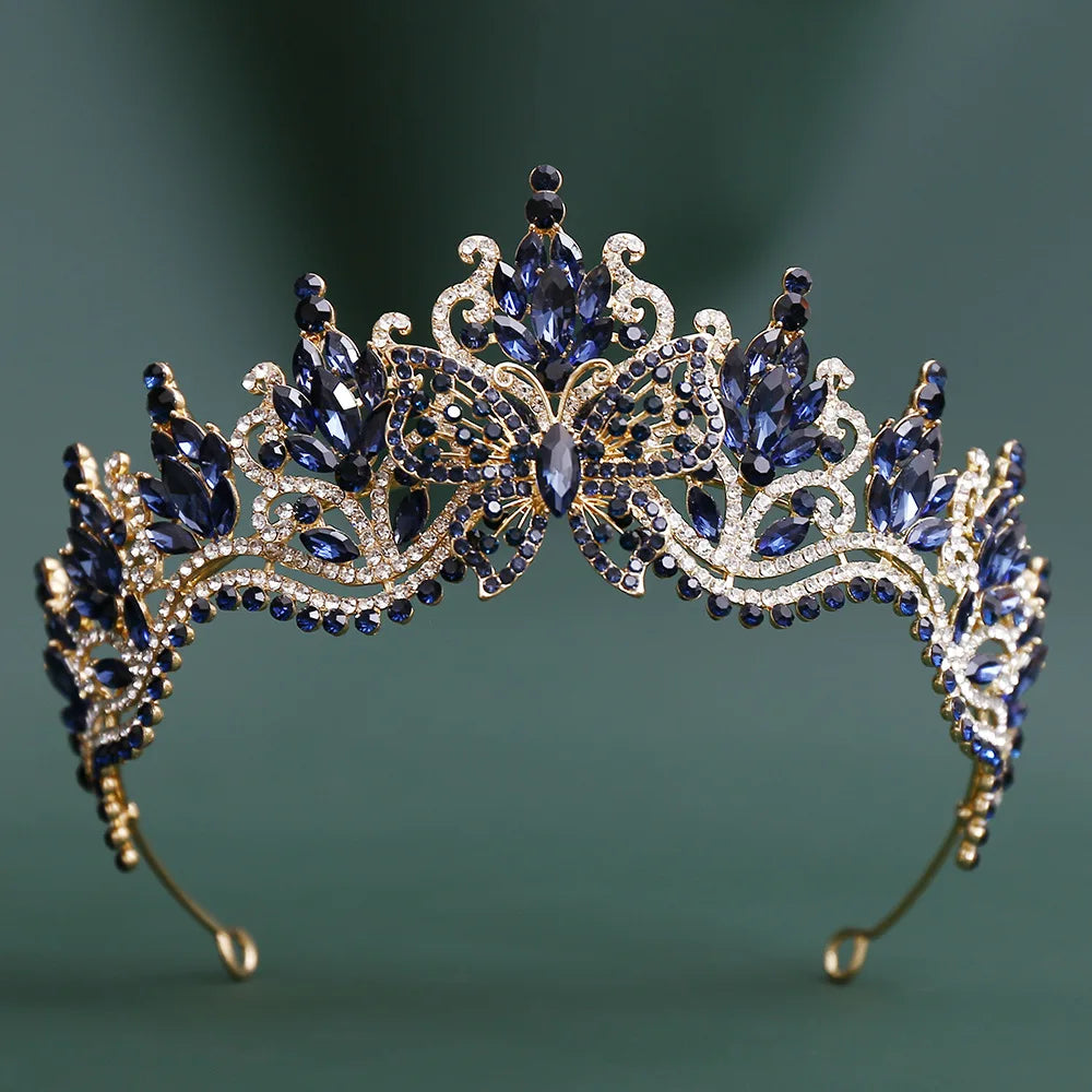 Blue rhinestone tiara crown with butterfly-like detailing and sparkling fringe