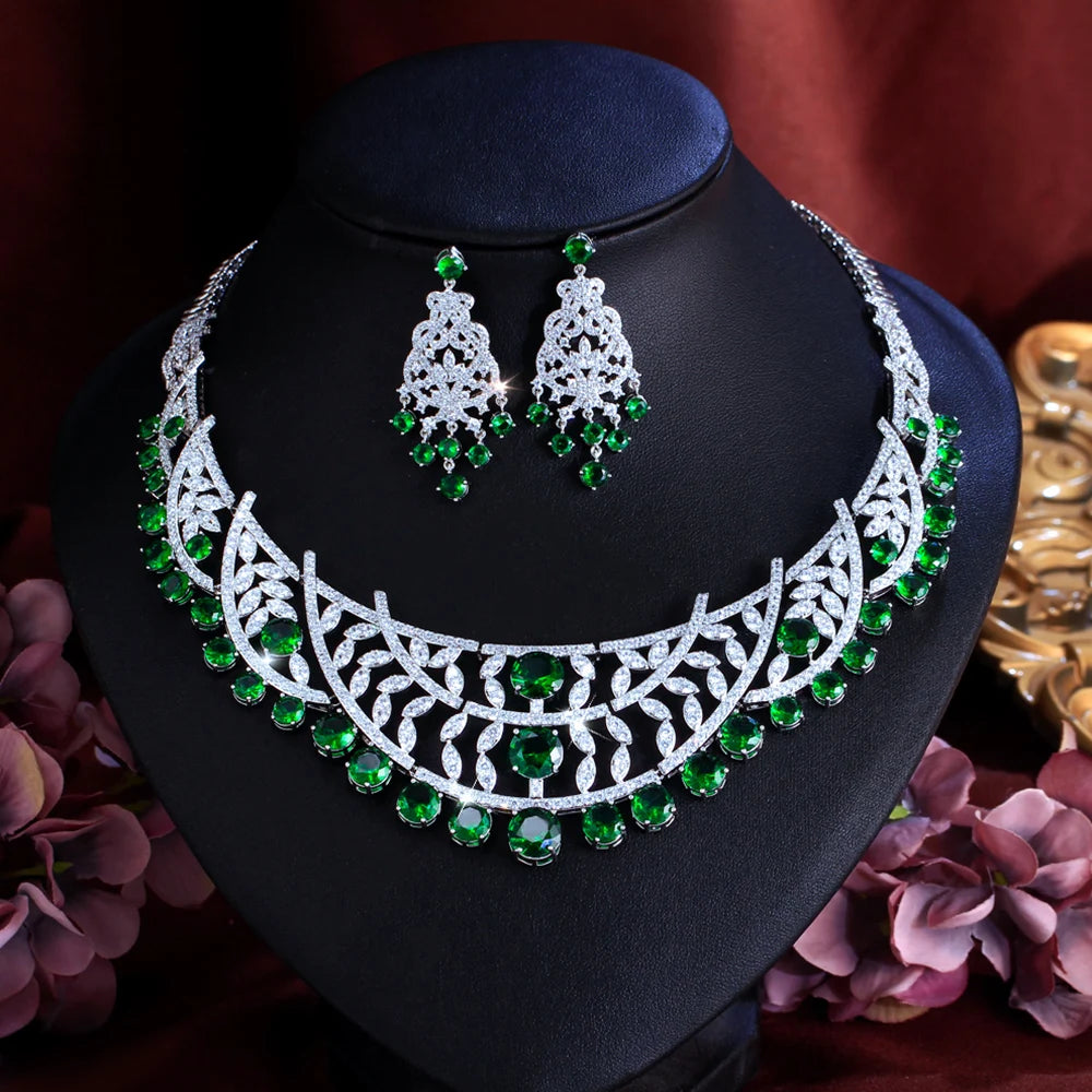 Necklace and earring set on bust: silver lattice with green cubic zirconia stones