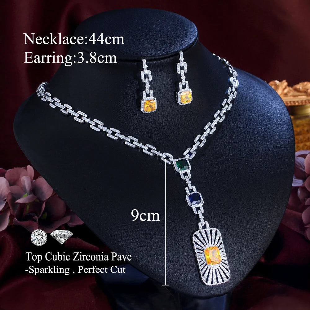 Zirconia cuban link necklace set on bust, square drop charms with yellow and blue stones