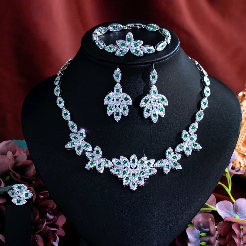 Green zirconia floral jewelry set display: necklace, drop earrings, hinged bracelet