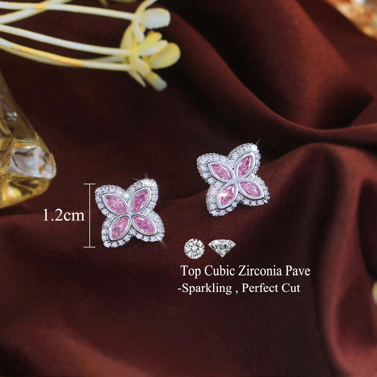 Pair of pink four-leaf cubic zirconia stud earrings, about 1.2 cm wide