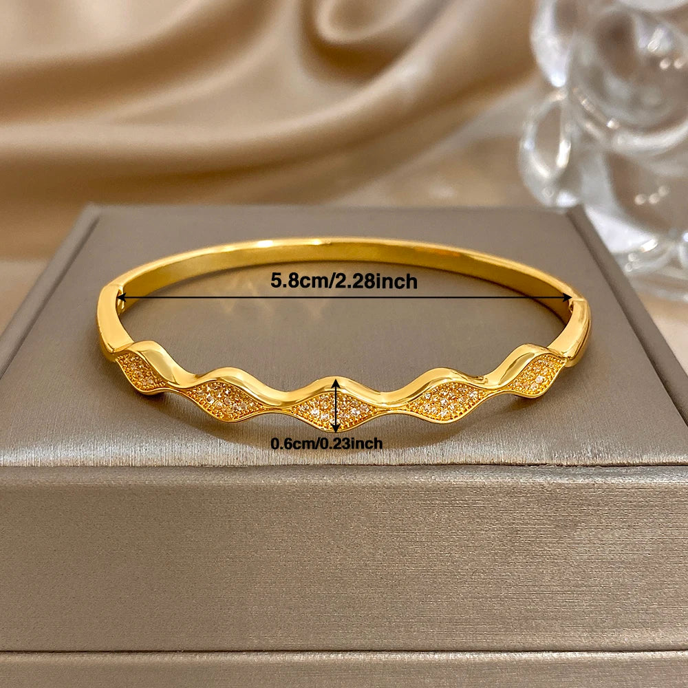 Gold-plated wave cuff bangle bracelet, 5.8 cm inner size; 0.6 cm width