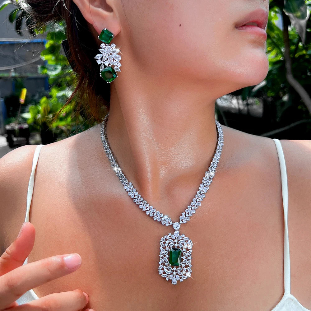 Cubic zirconia flower necklace and earring set with green stones and clear crystal details