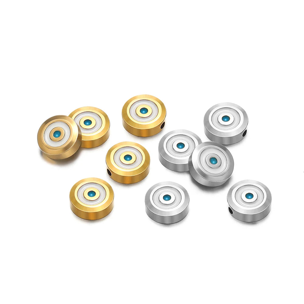 Assorted round evil-eye enamel beads in gold and silver tones with blue centers