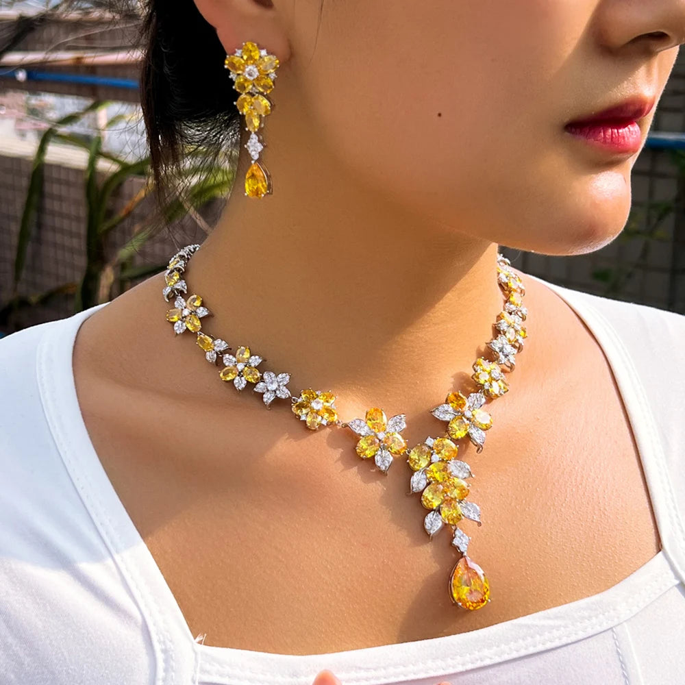 Yellow and clear flower zircon necklace and drop earrings worn as a set