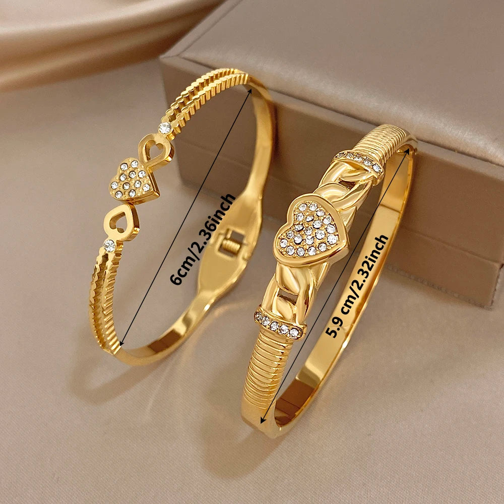 Gold-tone heart cuff bangles with clear rhinestone inlay and braided rope texture