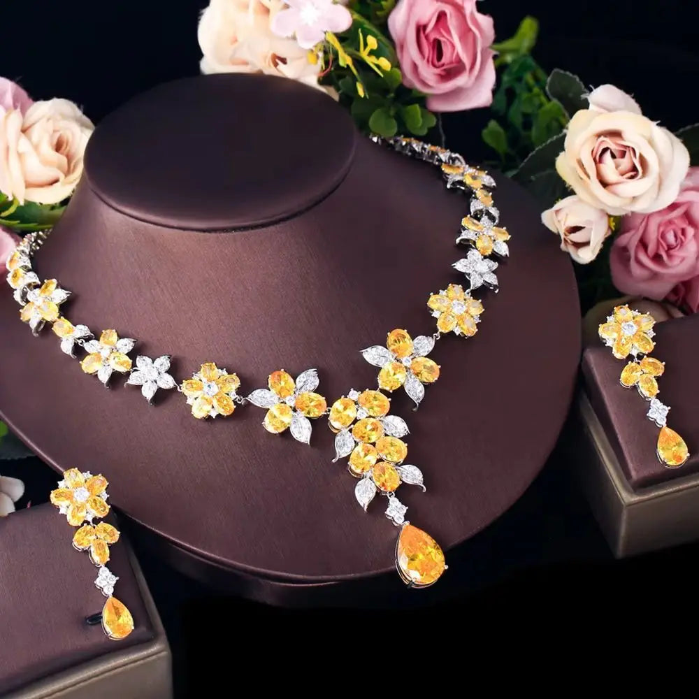 Angled view of the flower zircon necklace and matching drop earrings