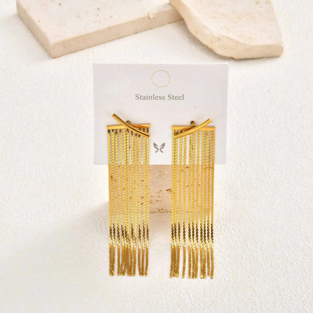 Gold stainless steel chain fringe tassel earrings on a jewelry card