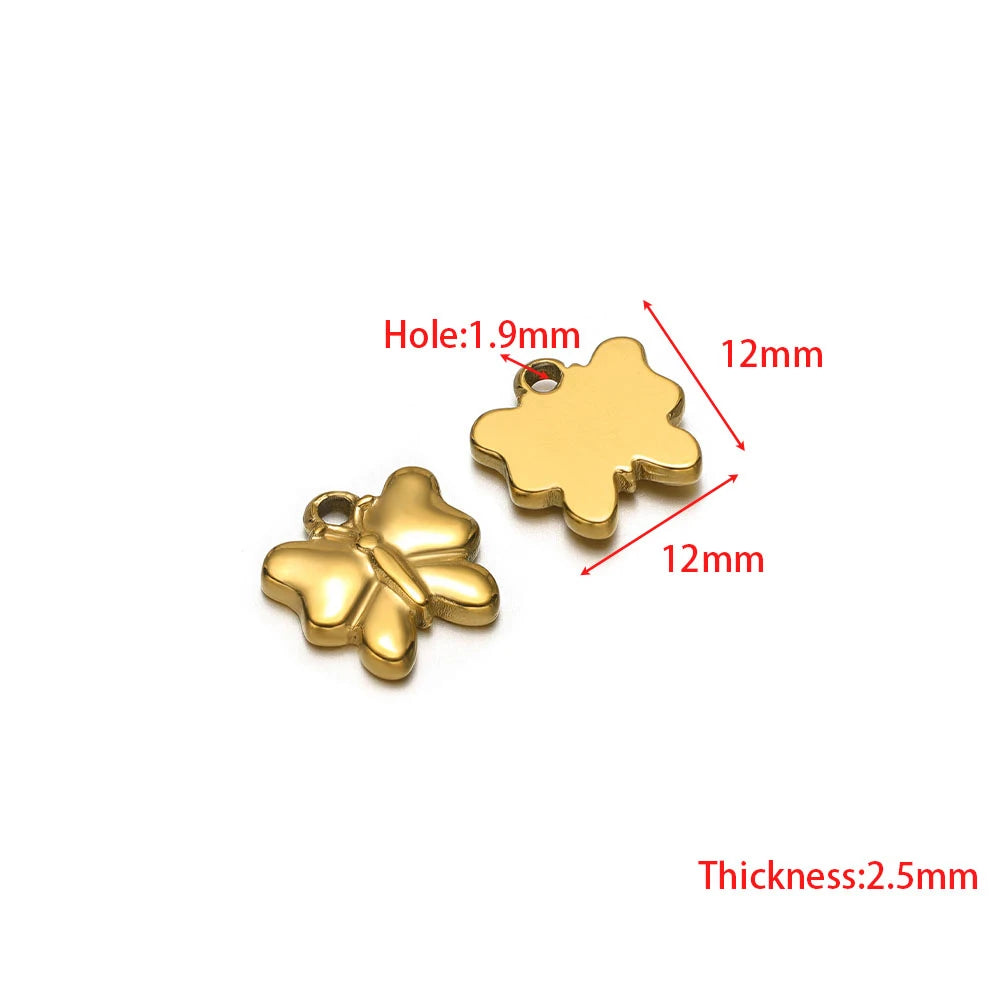 Stainless steel clover and leaf-like charms with jump ring holes, gold-tone pair