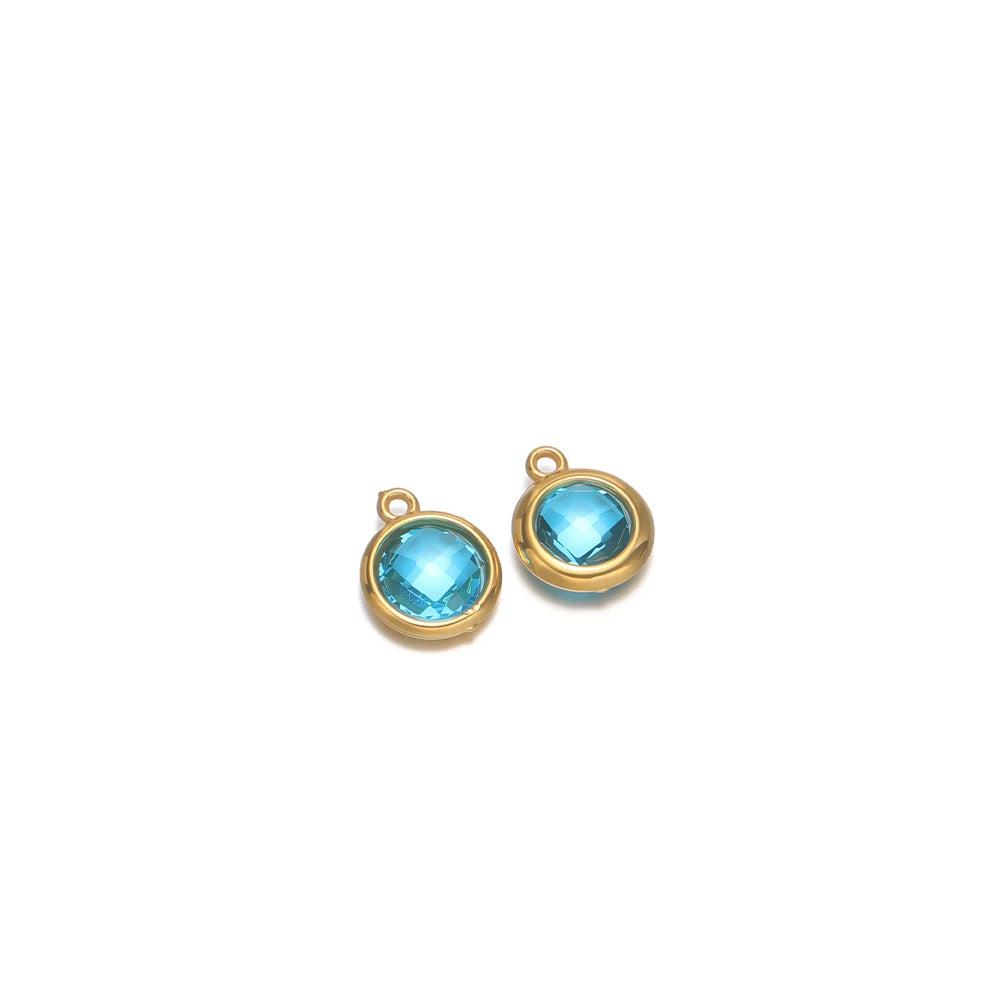 Round faceted glass charm pair in light blue with gold-tone metal loops