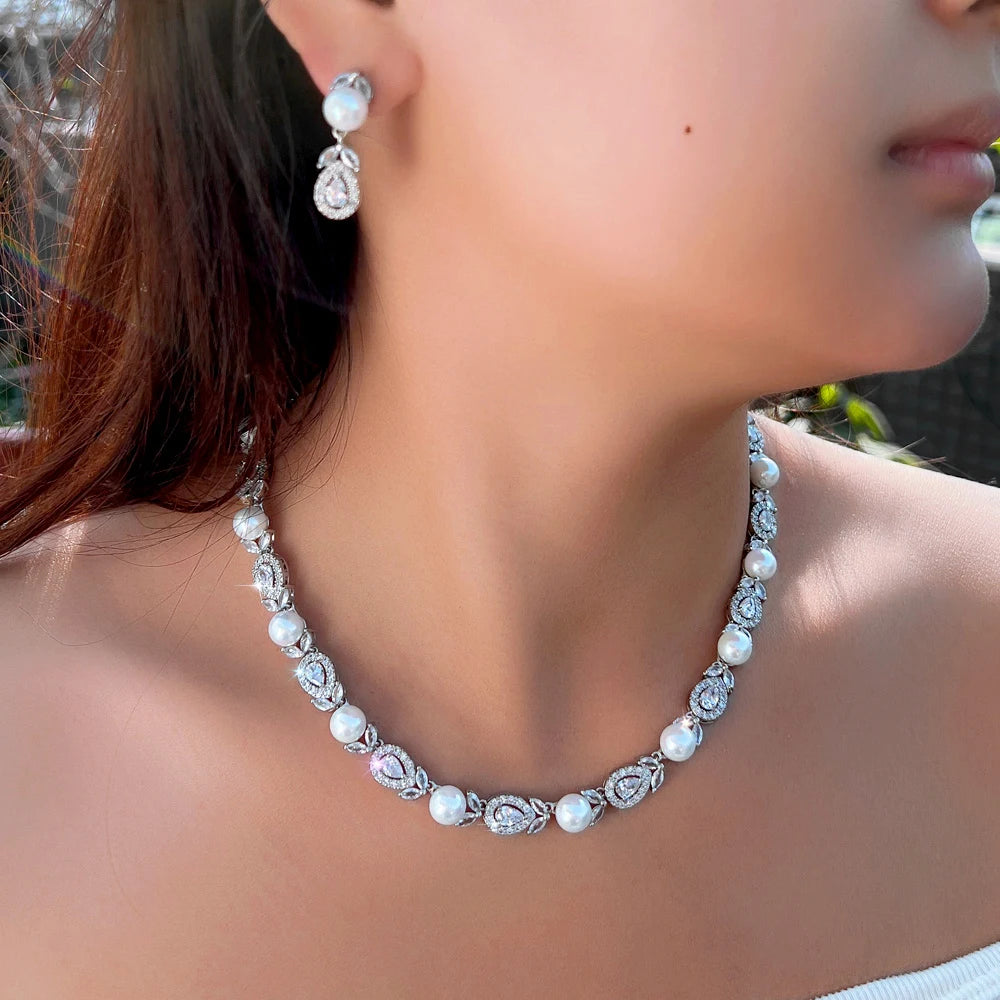 White-tone pearl bead necklace with cubic zirconia leaf-style links and drop earrings