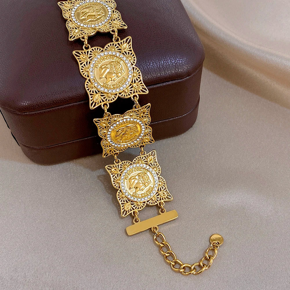 Gold-tone coin rhinestone bracelet with dangling medallions and adjustable extension chain