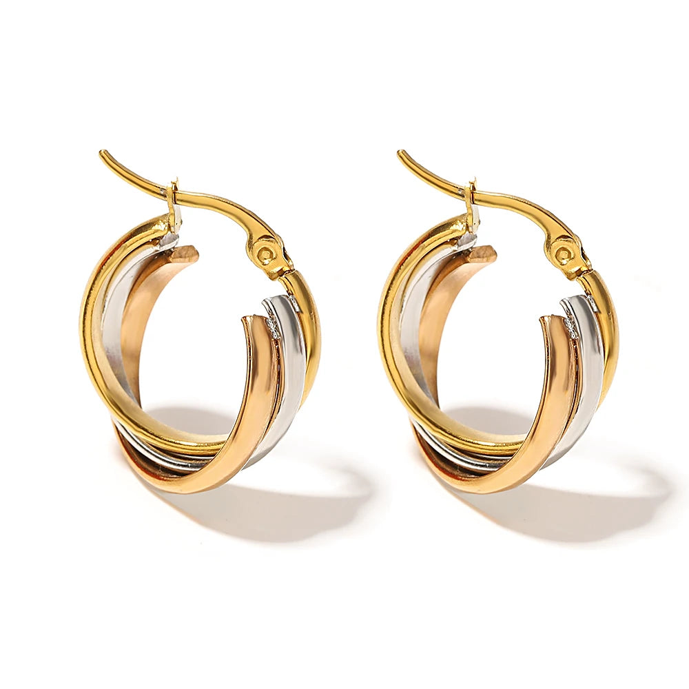 Pair of twisted hoop earrings with gold, silver, and rose-gold color bands