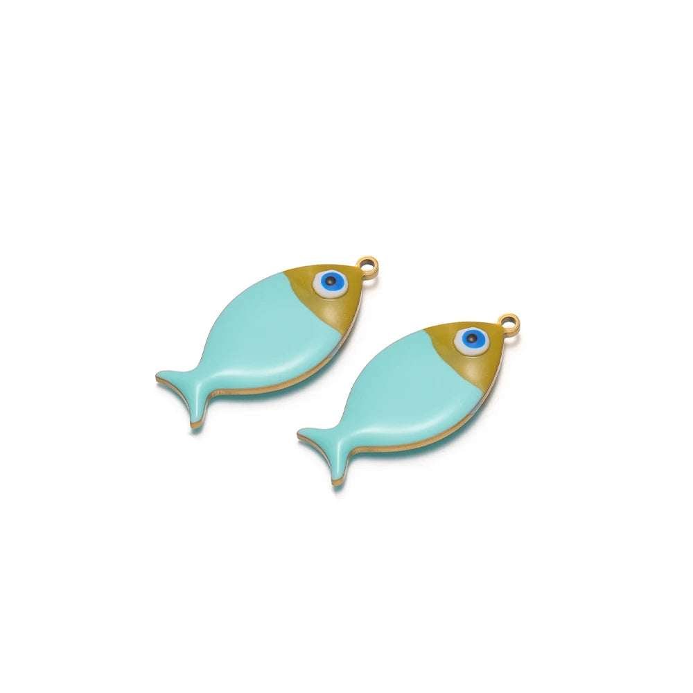 Two teal enamel fish charms with gold-tone loops and blue eye accents