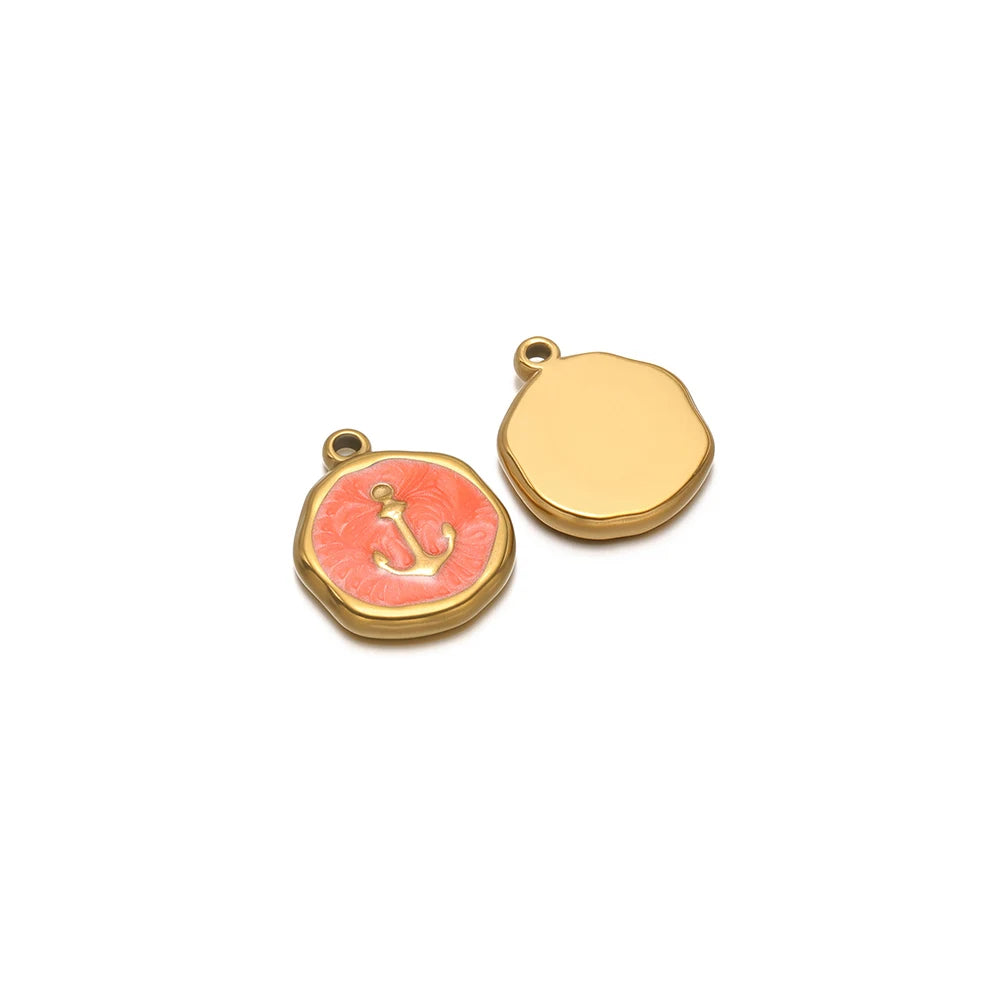 Round enamel charm pendant with gold border, coral paw design and plain gold charm