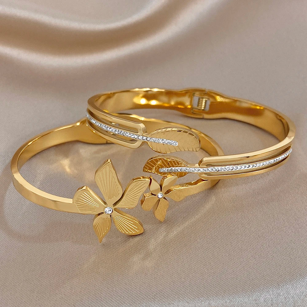Gold-plated stainless steel cuff bangle with leaf and flower zircon accents