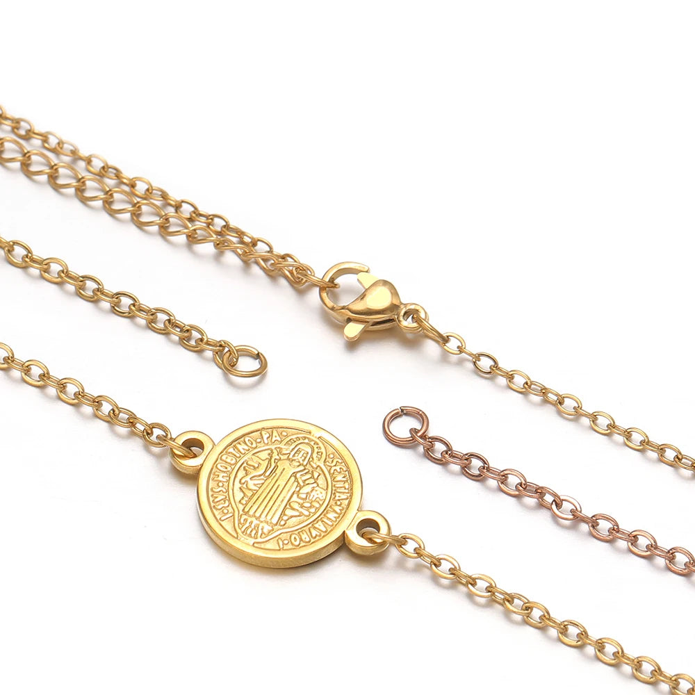Gold-tone flat link bracelet with extension chain, lobster clasp, and connector ring detail