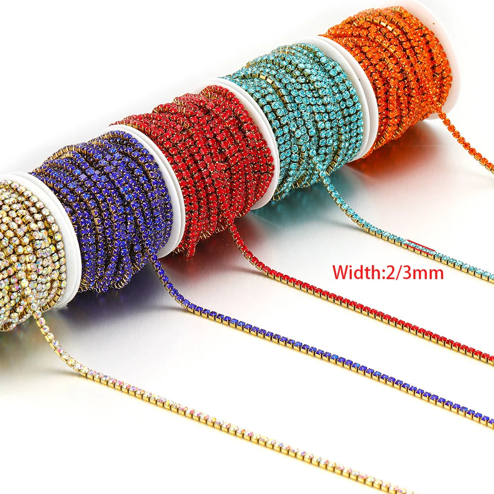 Rhinestone crystal chain tassel spools in orange, teal, red, blue, and gold, with strands