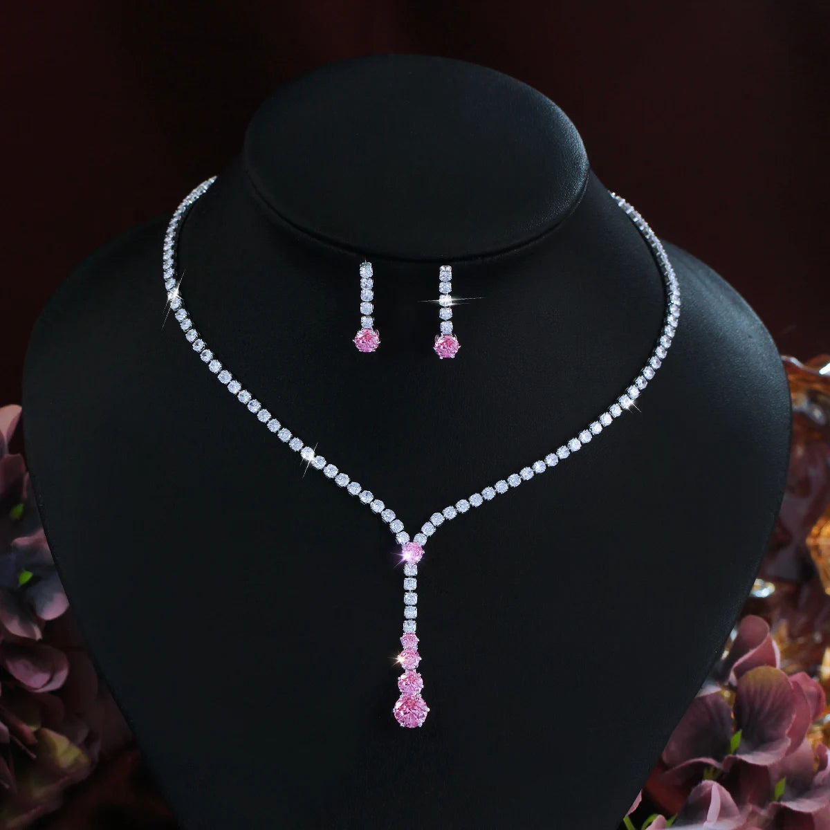 Cubic zirconia necklace and drop earrings with clear stones and pink accents