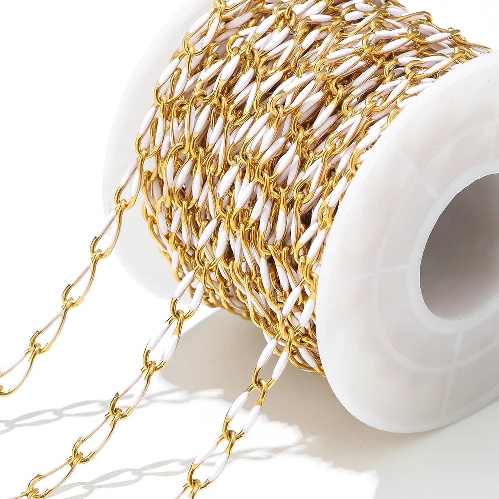 Twisted enamel chain gold and white links on a spool with hanging chain