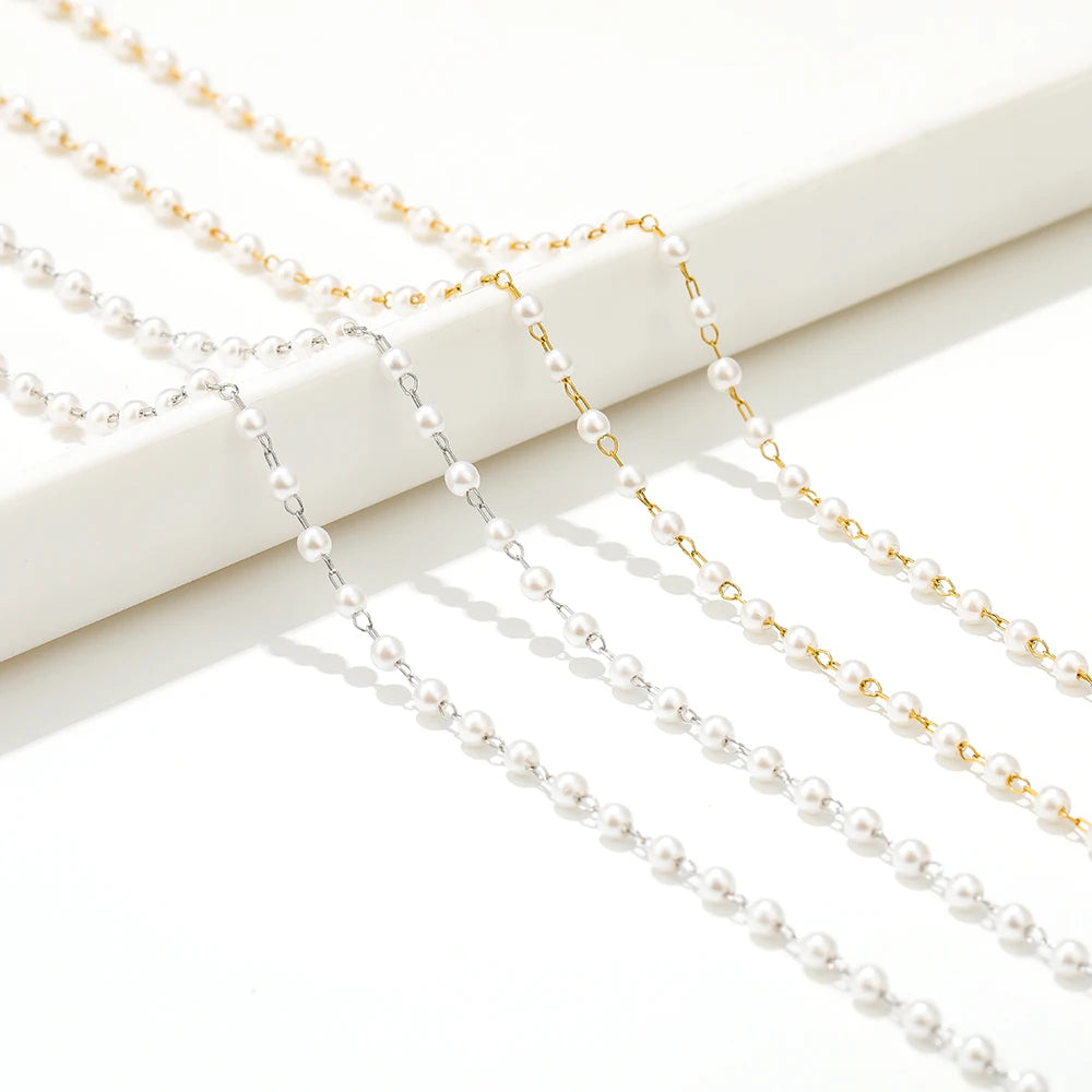 White imitation pearl chain with alternating gold-tone and silver-tone links for bracelets