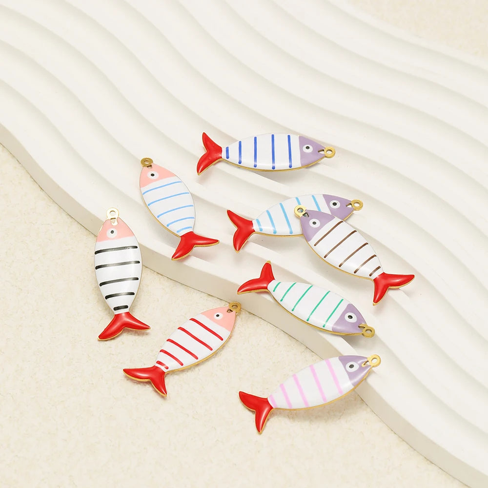 Striped fish enamel pendants with gold loops, blue, pink, and green stripes