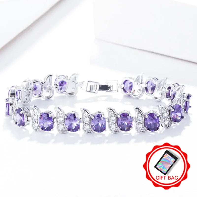 Purple oval crystal tennis bracelet with silver-tone leaf accents and clasp
