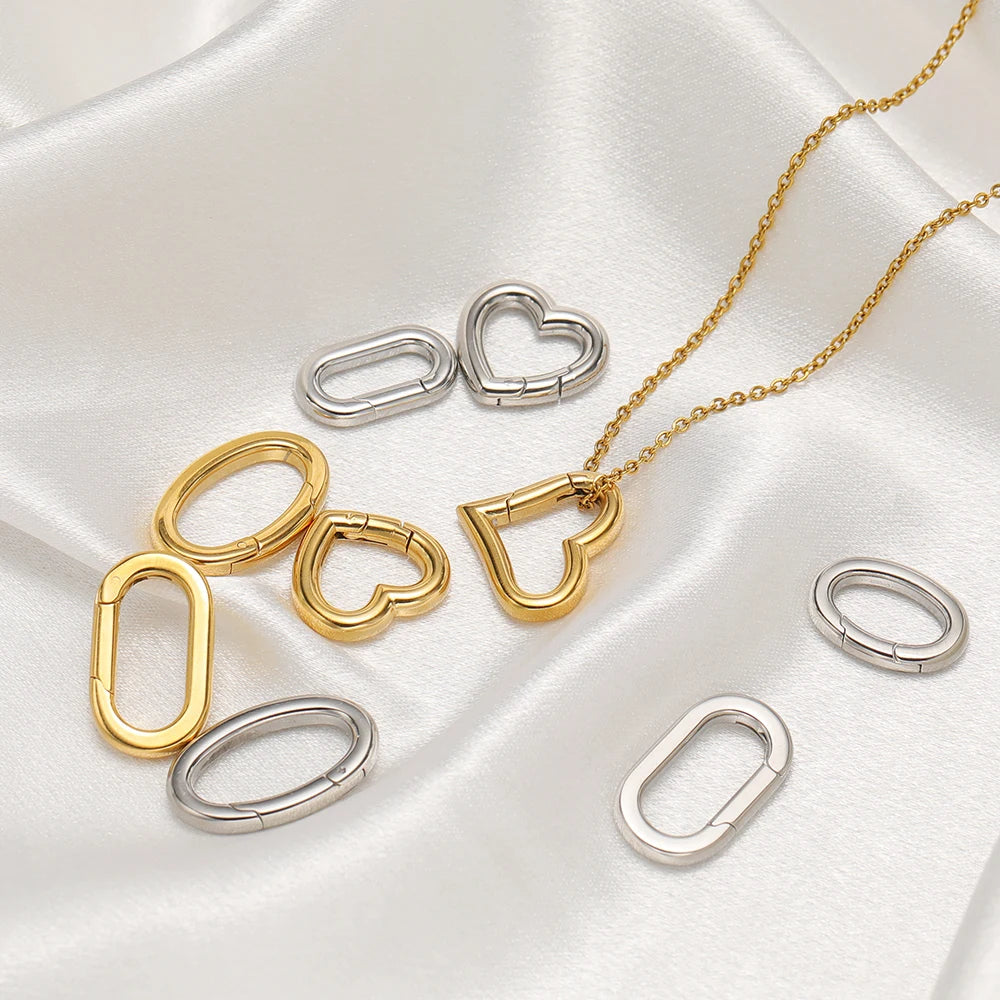 Heart spring buckle clasps in gold and silver tones, oval connectors for necklaces