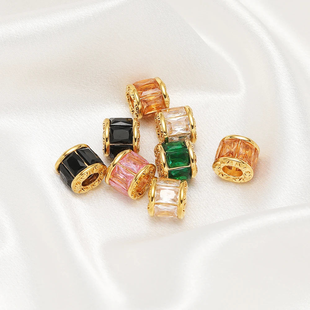 Gold-plated spacer beads in black, green, pink, and orange crystal colors