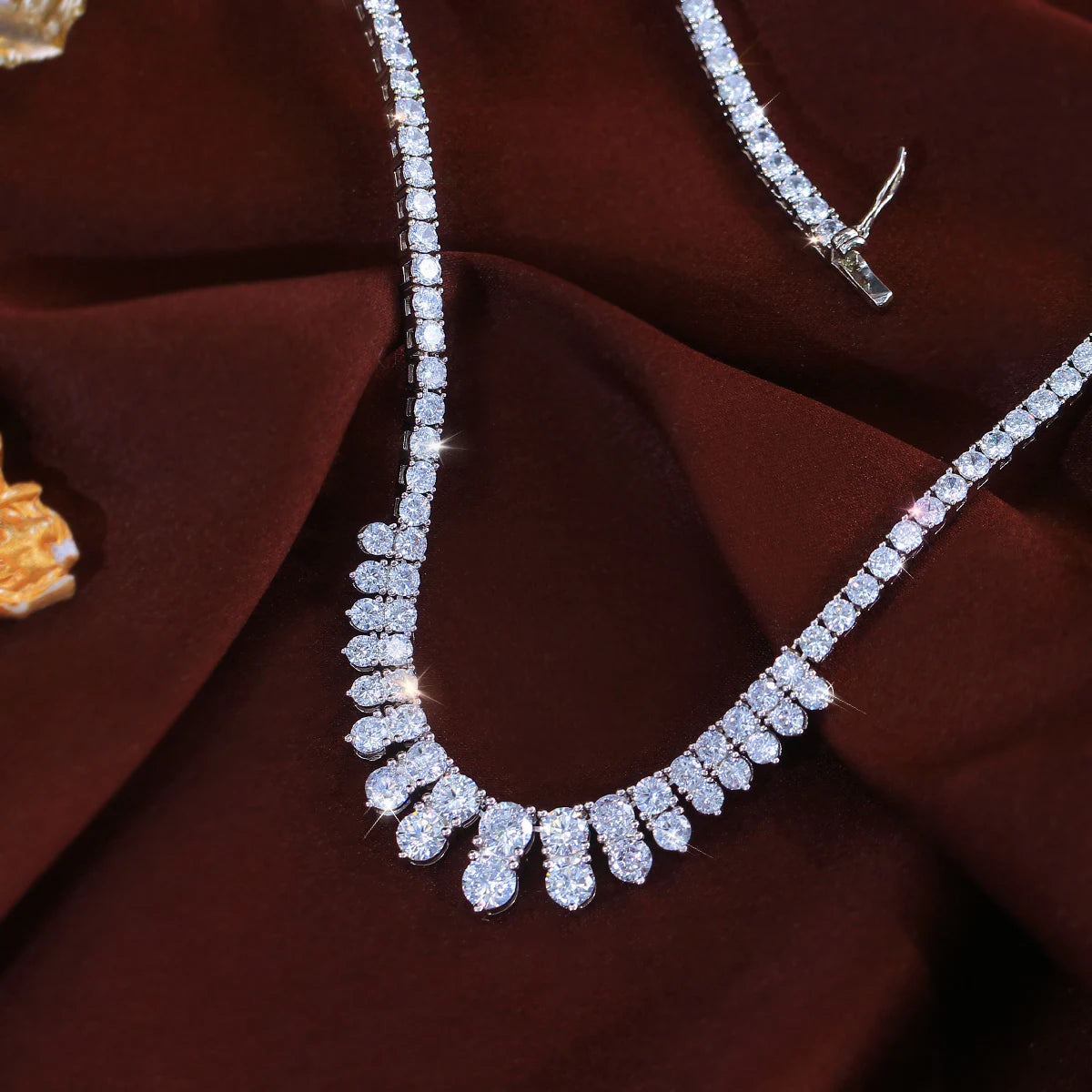 Close-up of cubic zirconia necklace chain and graduated teardrop stones
