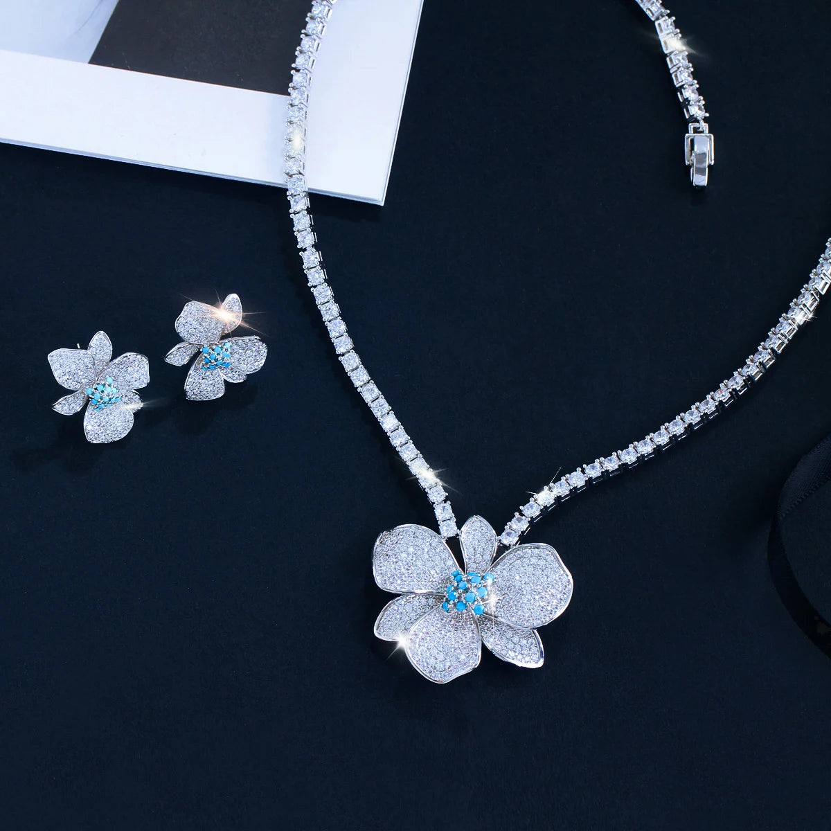 Crystal flower pendant necklace and matching flower stud earrings