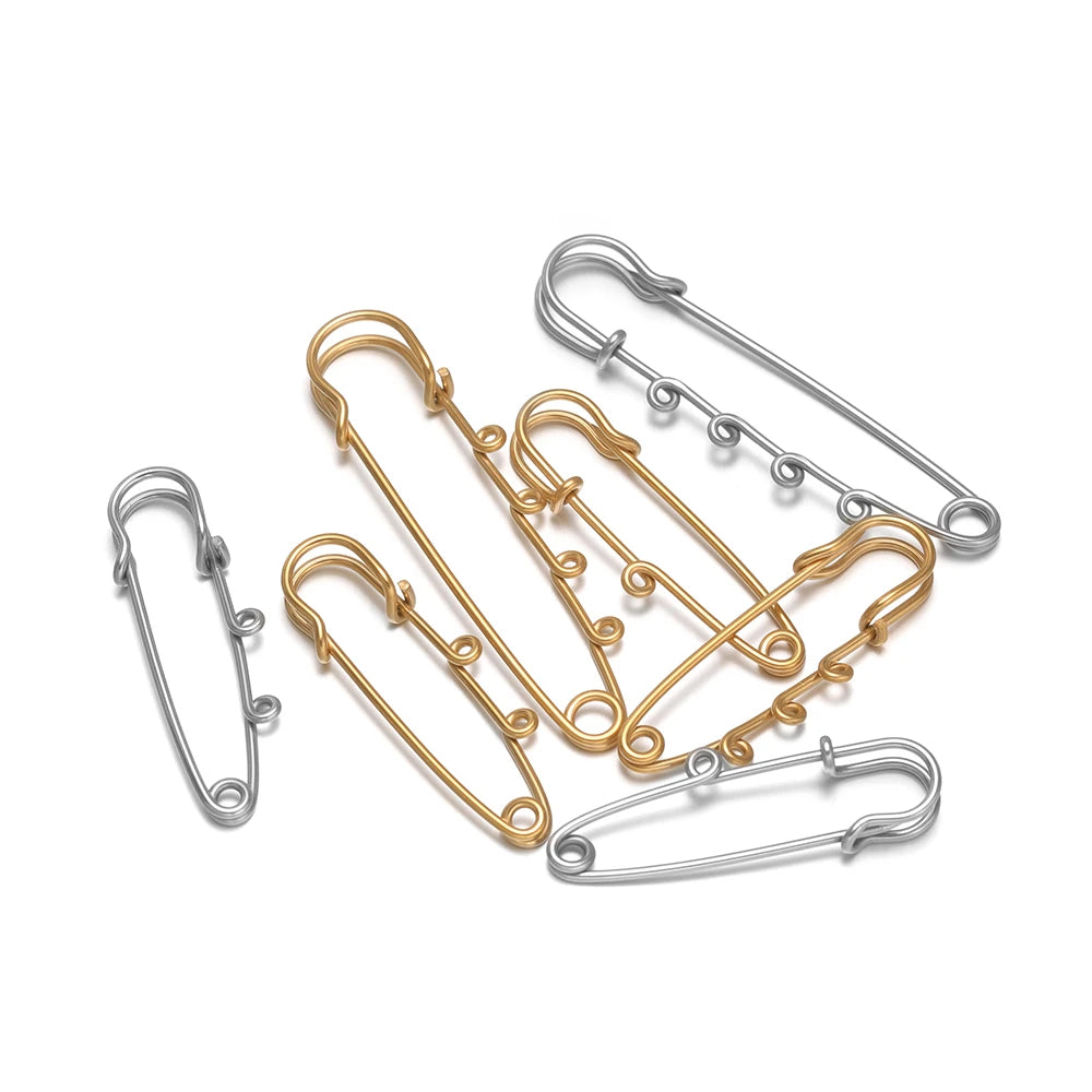 Set of multi-hole safety pin brooch fasteners in silver and gold