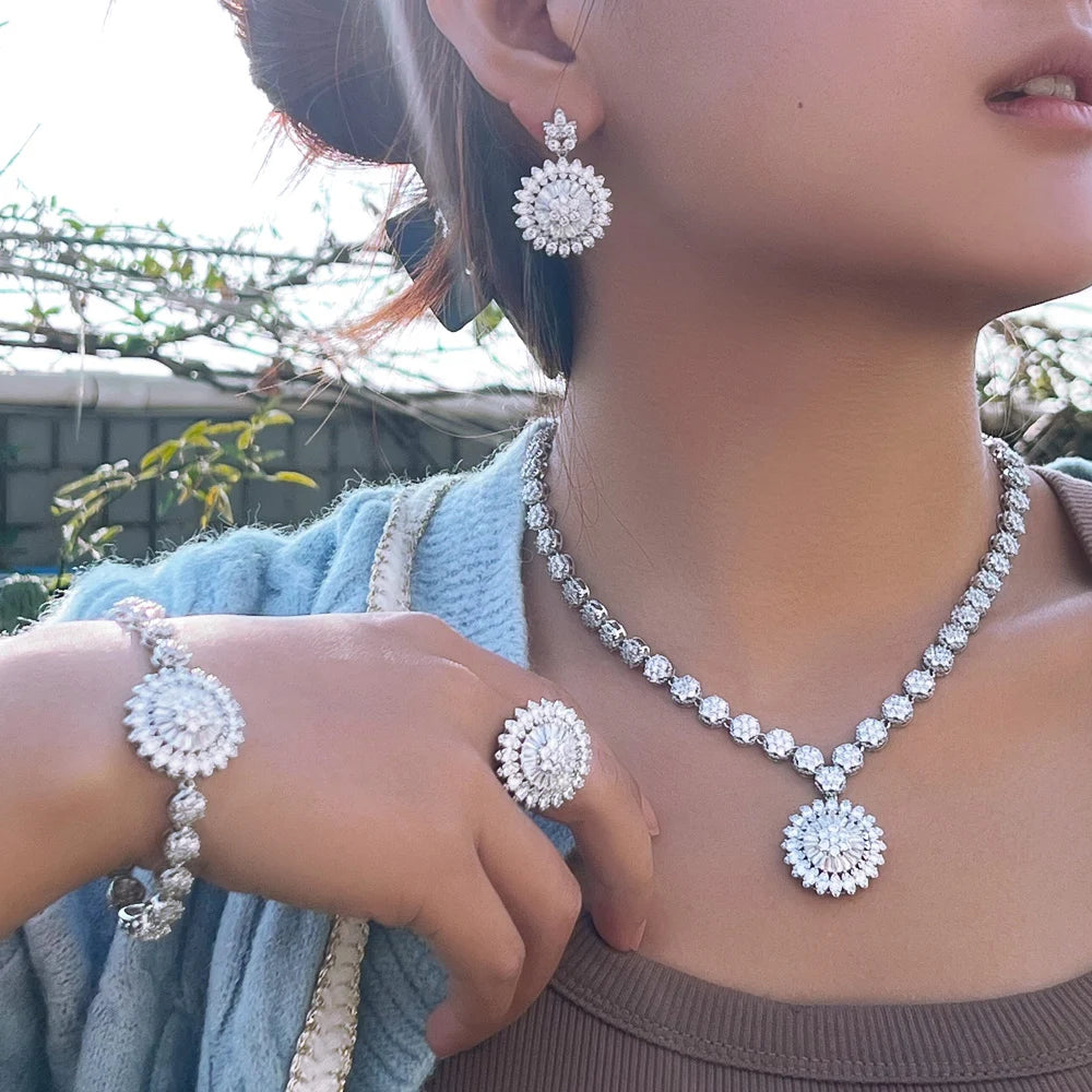 Silver-tone sunflower zirconia jewelry set: necklace, bracelet, ring, stud earrings.
