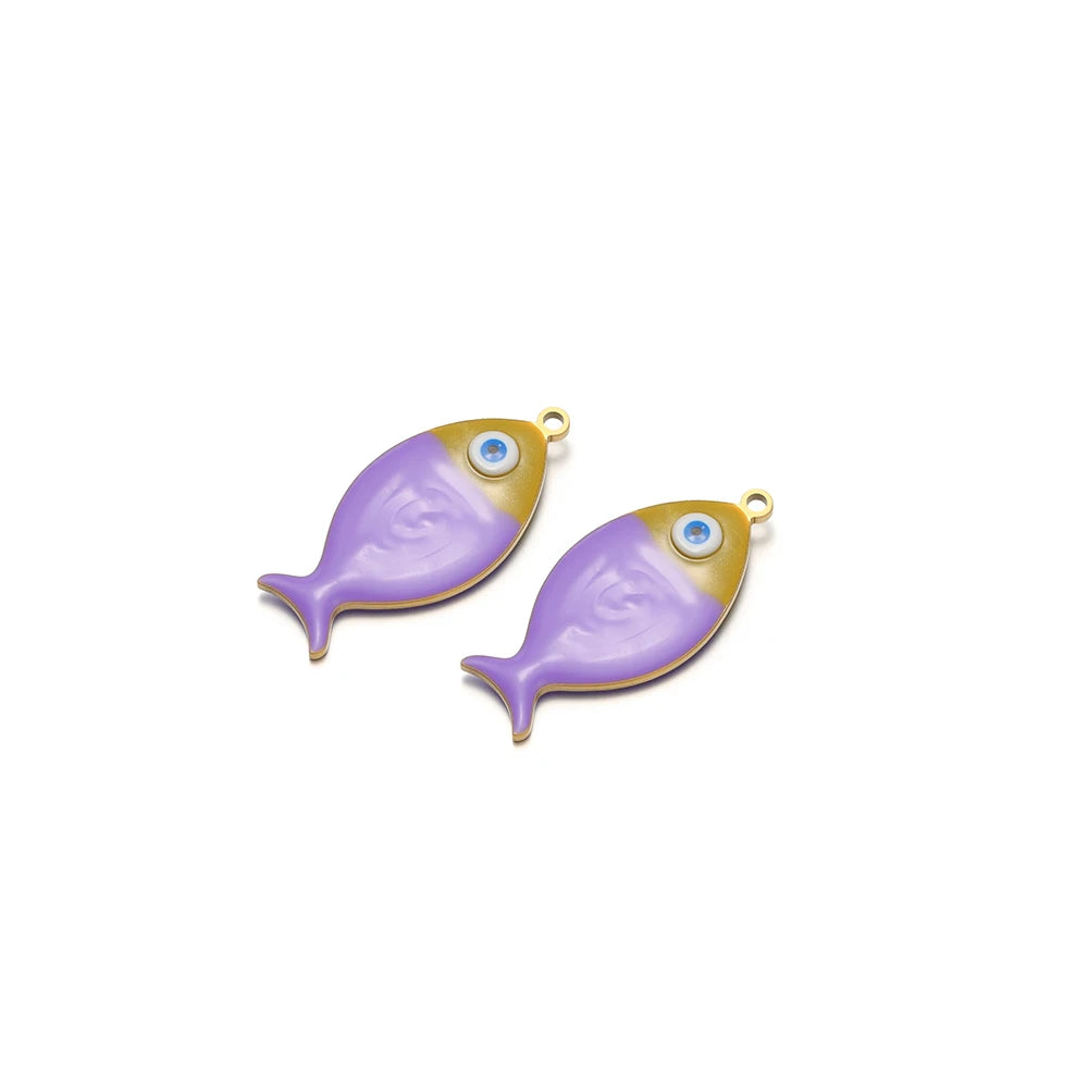 Two purple enamel fish charms with gold-tone loops and blue eye accents